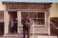 Taken in 1946, this building is the third to hold the Co-op store in Merasheen and was built in 1941. At a board meeting in January 1941, the possibility of building a new store as well as the amount of material required to do so was discussed. It was decided to give each member a slip outlining the amount of sticks each was expected to give. The size of the building was to be 14x24. In February 1941, the site was chosen and at the next meeting in March, Mr. Austin Pomroy was appointed foreman to build the new store. It opened later that year.&amp;nbsp; The lady in the doorway is Helen Fleming, sister of Fr. John Fleming who married Pat Canning.&amp;nbsp; The couple is most likely a young John and Lizzie Ennis.