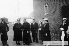 From the left : man in the hat is Casimir Doody (Fr. Jim Doody's father); Jane (Hann) Pomeroy (half sister of Din Pat Walsh) ; Father James Doody ; Din Pat Walsh; Mary Ellen (Mamie)(Ennis) Walsh; Ernie Walsh; Stella (Walsh) Best (half sister of Jane &amp;amp; sister&amp;nbsp;of Din Pat); Ethis (Ennis) Best sister of Mamie. Ethie is talking to Mrs Mary Best. Taken 16 June 1959 after Fr Denis Walsh's 1st mass in Merasheen and reception &amp;amp; dinner in Parish Hall.